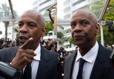 Agraciado com uma Palma de Ouro honorária, Denzel Washington discute com fotógrafo no Festival de Cannes